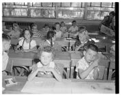 Children Sitting at Their Desks 
